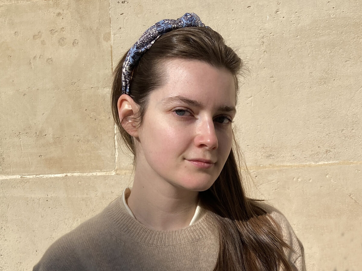 young lady wearing a blue hairband with dragonflies motif